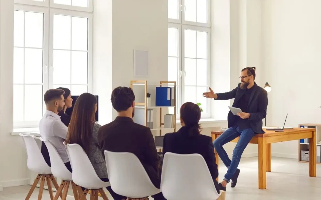 Professor leading a classroom discussion with college students