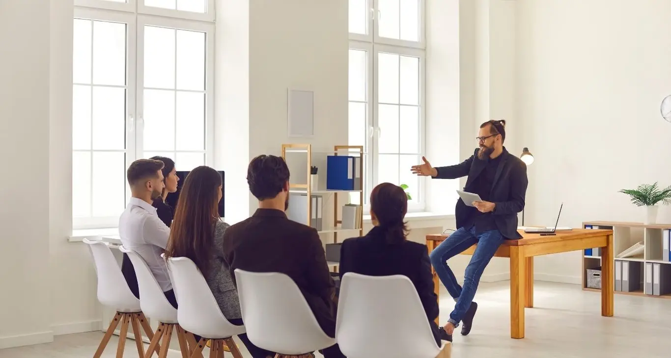 Professor leading a classroom discussion with college students